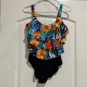 Like new one piece swimsuit w/ruffled top, size 8-10, beautiful bright floral.
